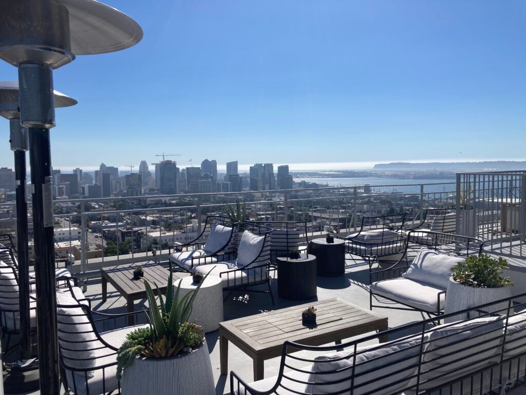 The East Patio at Mister A's with lounge seating overlooking downtown San Diego and the bay