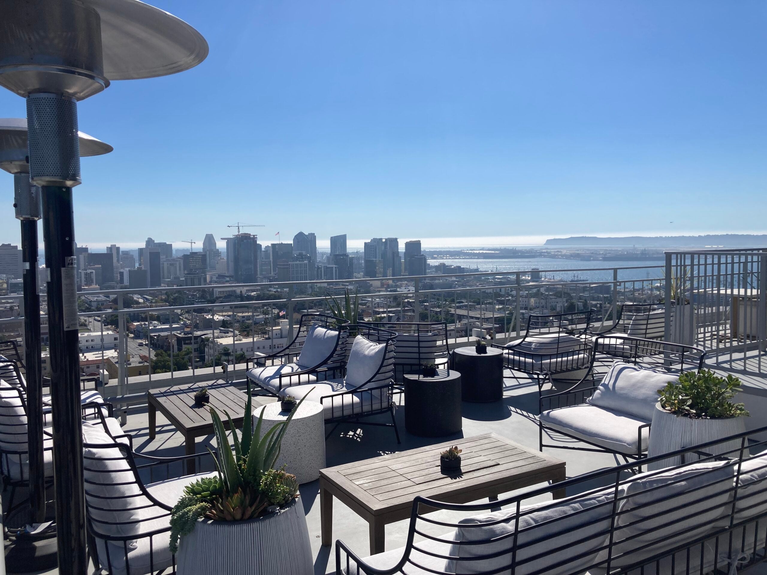 The East Patio at Mister A's with lounge seating overlooking downtown San Diego and the bay